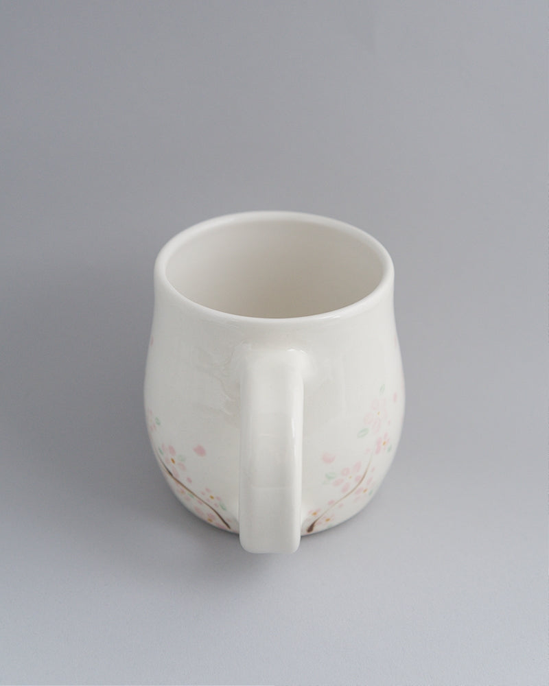 Primavera -Short mug with small pink flowers at the bottom